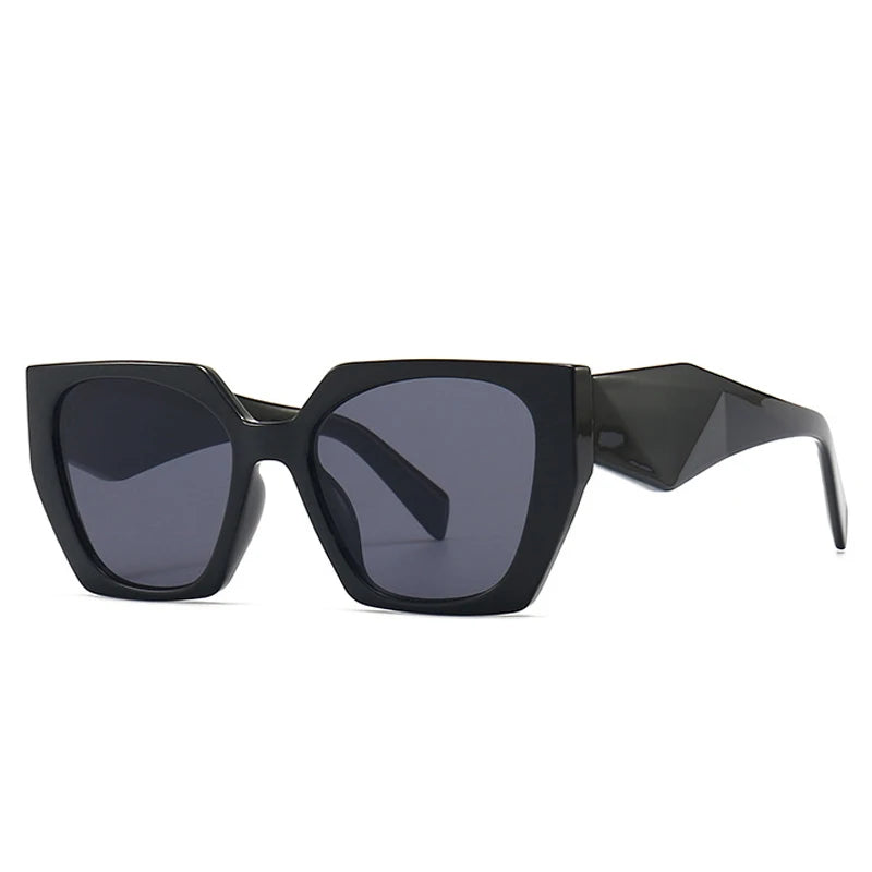 Black sunglasses with a geometric frame on a white background