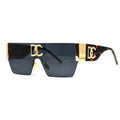 Sunglasses with gold accents and a distinctive logo on a white background