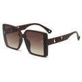 Brown sunglasses with gradient lenses on a white background