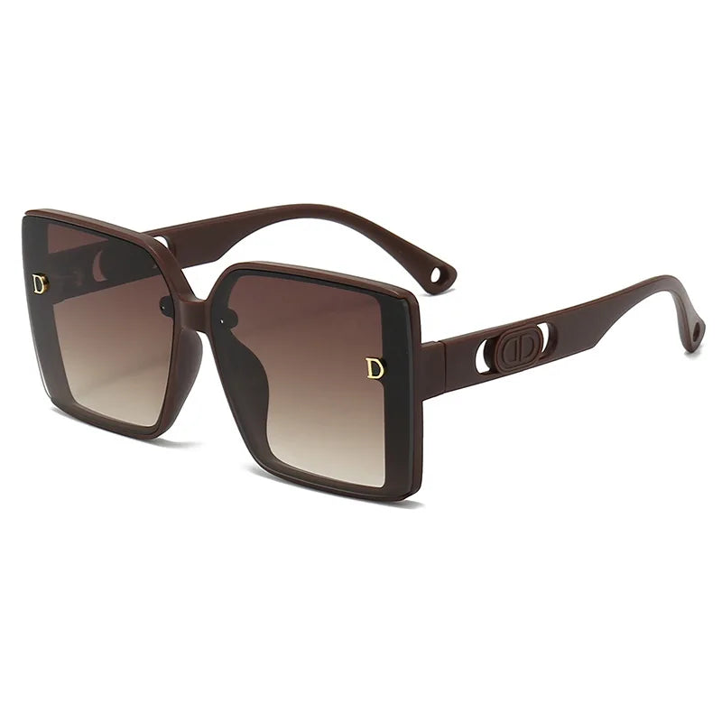 Brown sunglasses with gradient lenses on a white background