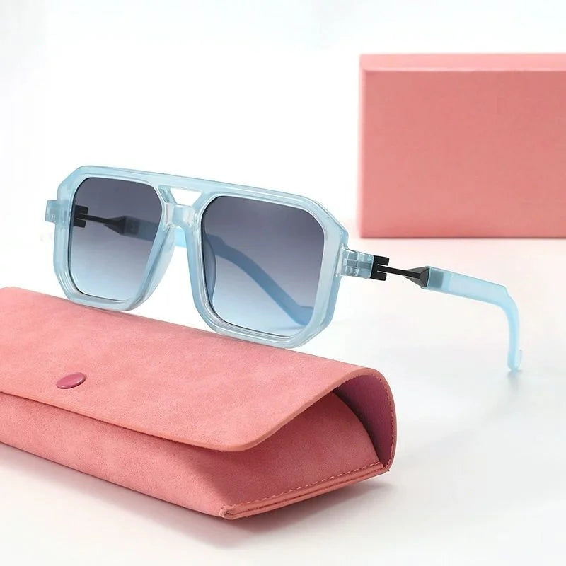 Blue sunglasses with pink case on a white background