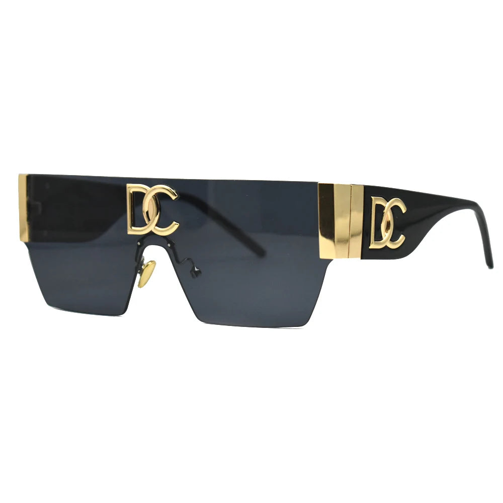 Sunglasses with gold accents and black lenses on a white background