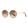Sunglasses with decorative embellishments on a white background