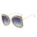 Sunglasses with decorative frame and gradient lenses on a white background