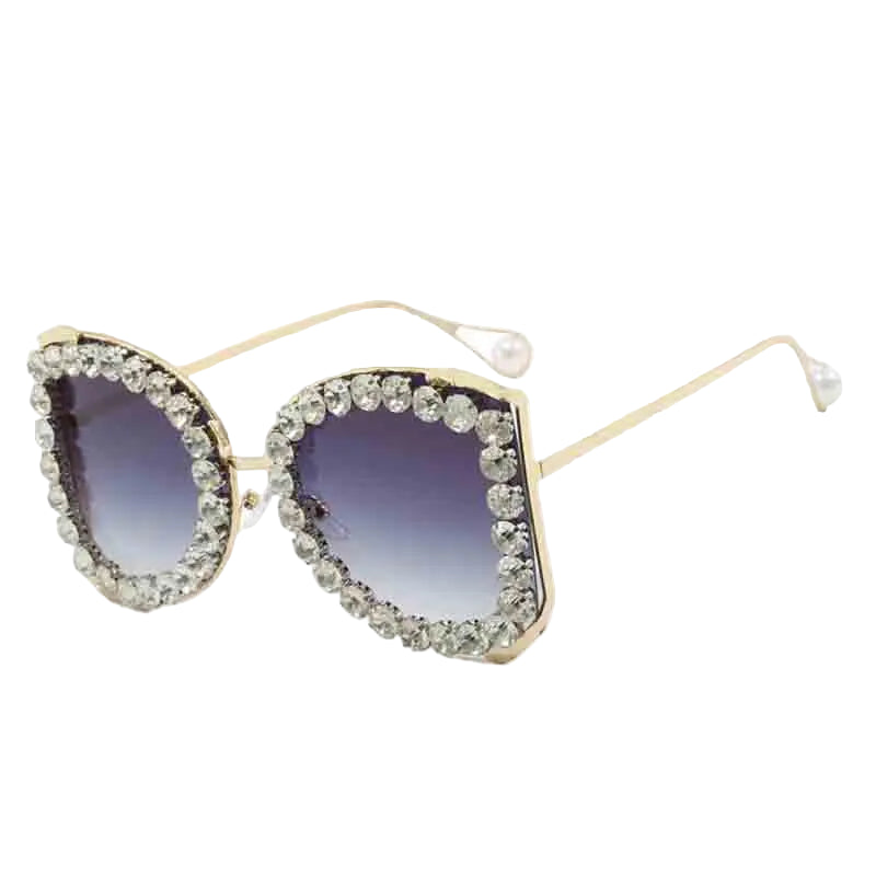 Sunglasses with decorative frame and gradient lenses on a white background