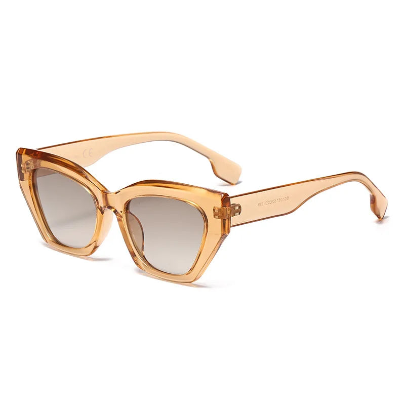 Orange cat-eye sunglasses on a white background