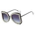 Sunglasses with decorative frame on a white background