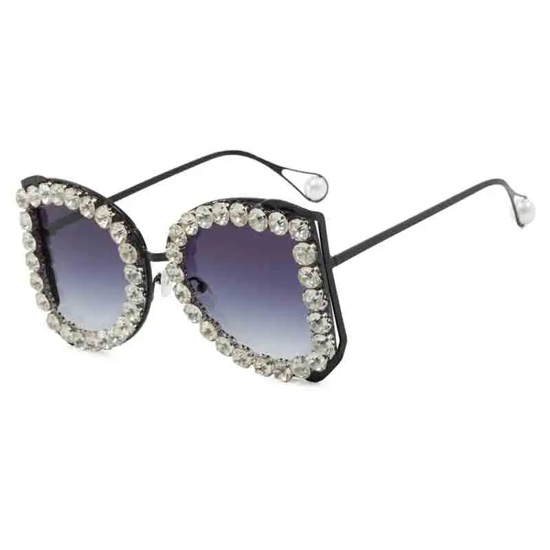 Sunglasses with decorative frame on a white background