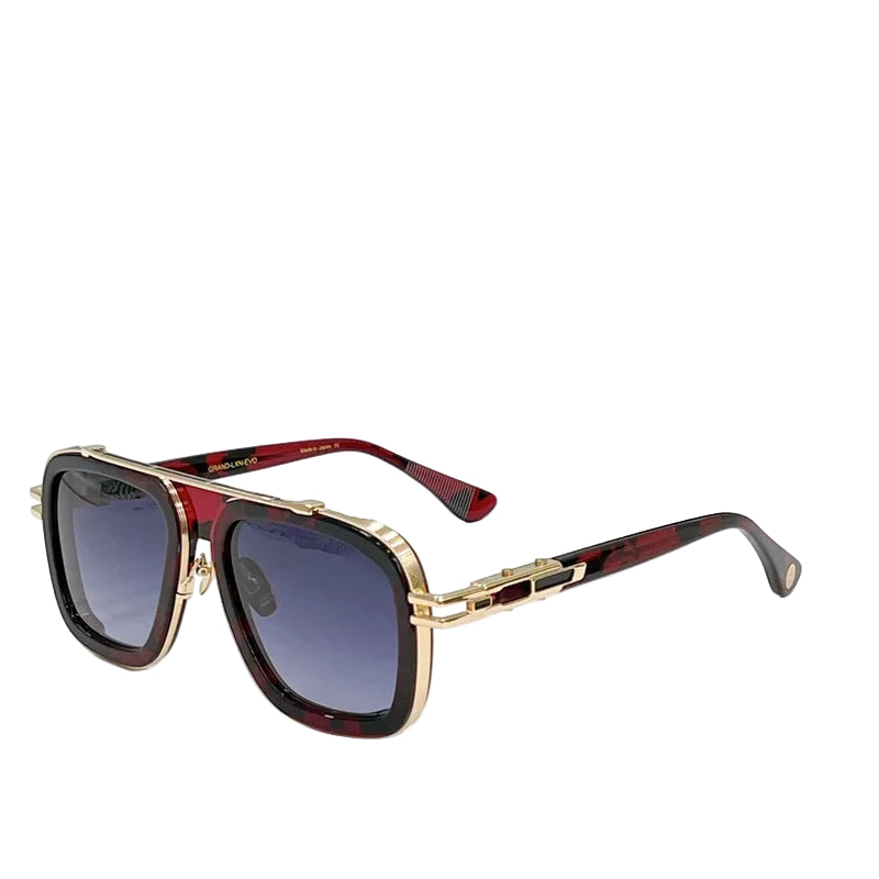 Sunglasses with gold and red frame on a white surface with a blue background