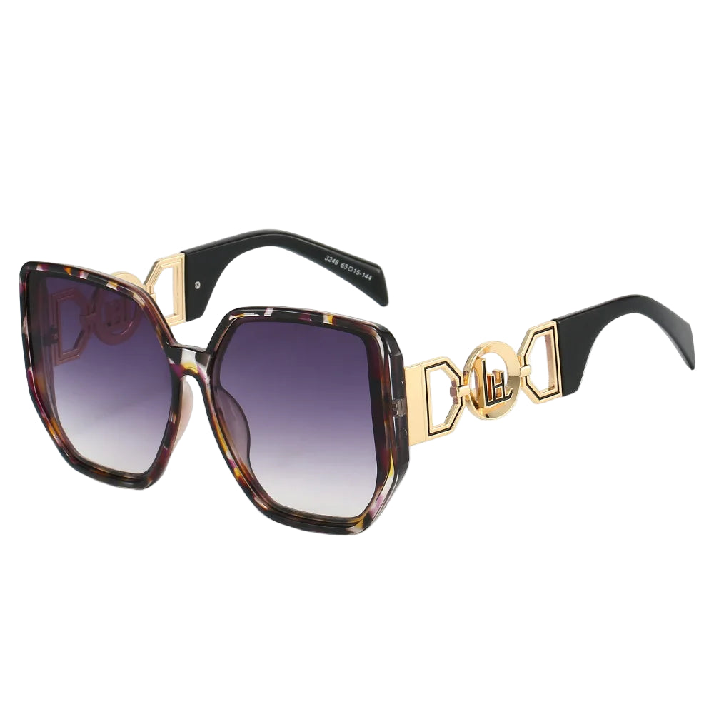 Sunglasses with tortoiseshell frame and gold accents on a white background
