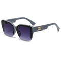 Sunglasses with dark lenses and a gray frame on a white background