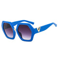 Blue sunglasses with a gold accent on a white background