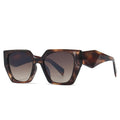 Sunglasses with tortoiseshell frame and dark lenses on a white background