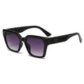 Black sunglasses with purple gradient lenses on a white background