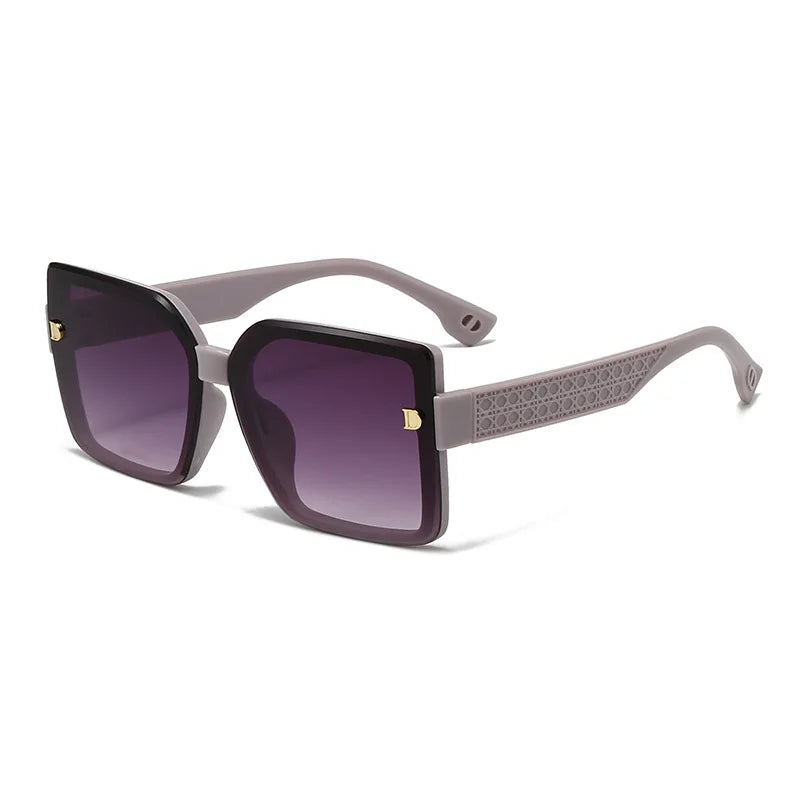 Sunglasses with purple gradient lenses and gray frame on a white background