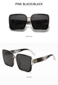 Sunglasses with pink and black frame and dark lenses on a white background