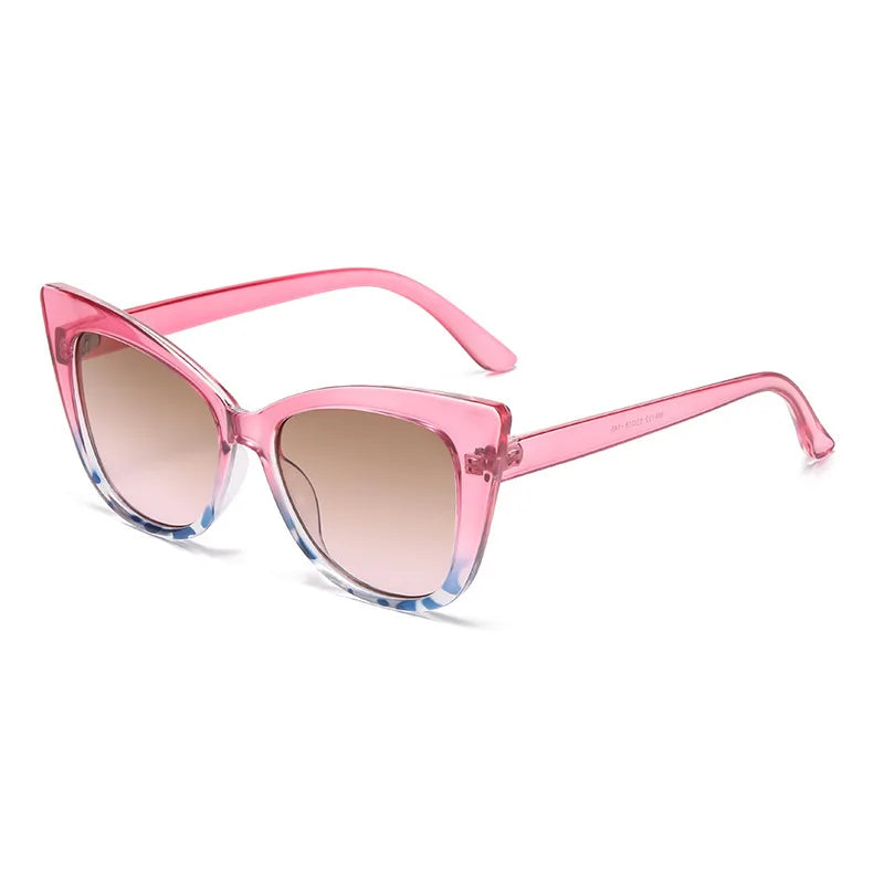 Pink cat-eye sunglasses with gradient lenses on a white background