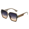 Sunglass with a decorative golden V on the arms on a white background