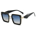 Sunglasses with black and gold frame and blue gradient lenses on a white background