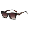 Sunglasses with brown gradient lenses and decorative arm on a white background