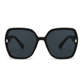 Black sunglasses with dark lenses on a white background