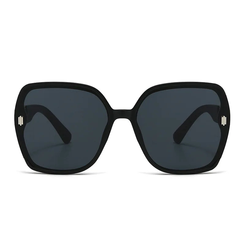 Black sunglasses with dark lenses on a white background