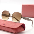 Sunglasses with quilted arm on a pink case against a white background