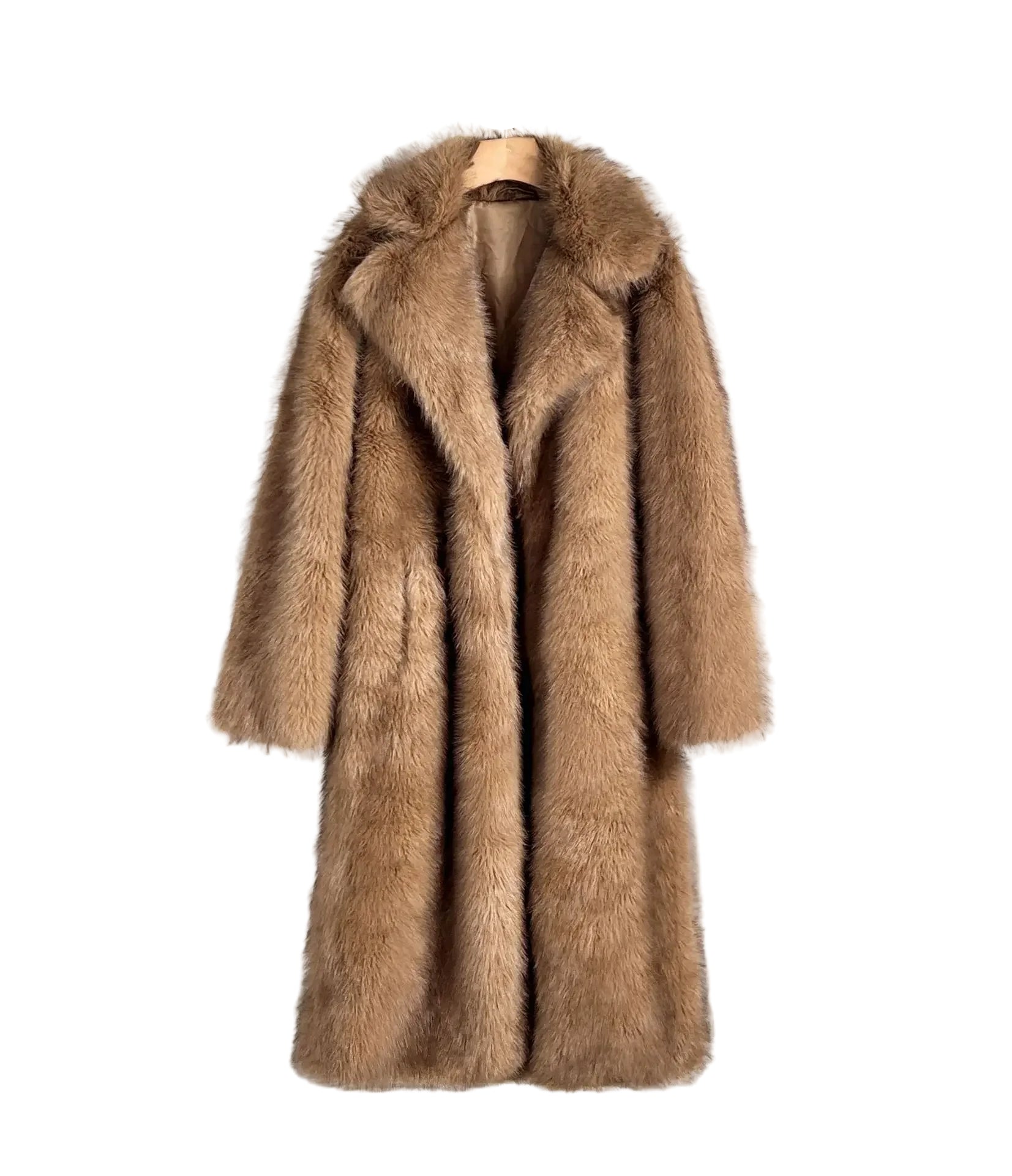 Brown fur coat on a hanger against a white wall with a black chair.