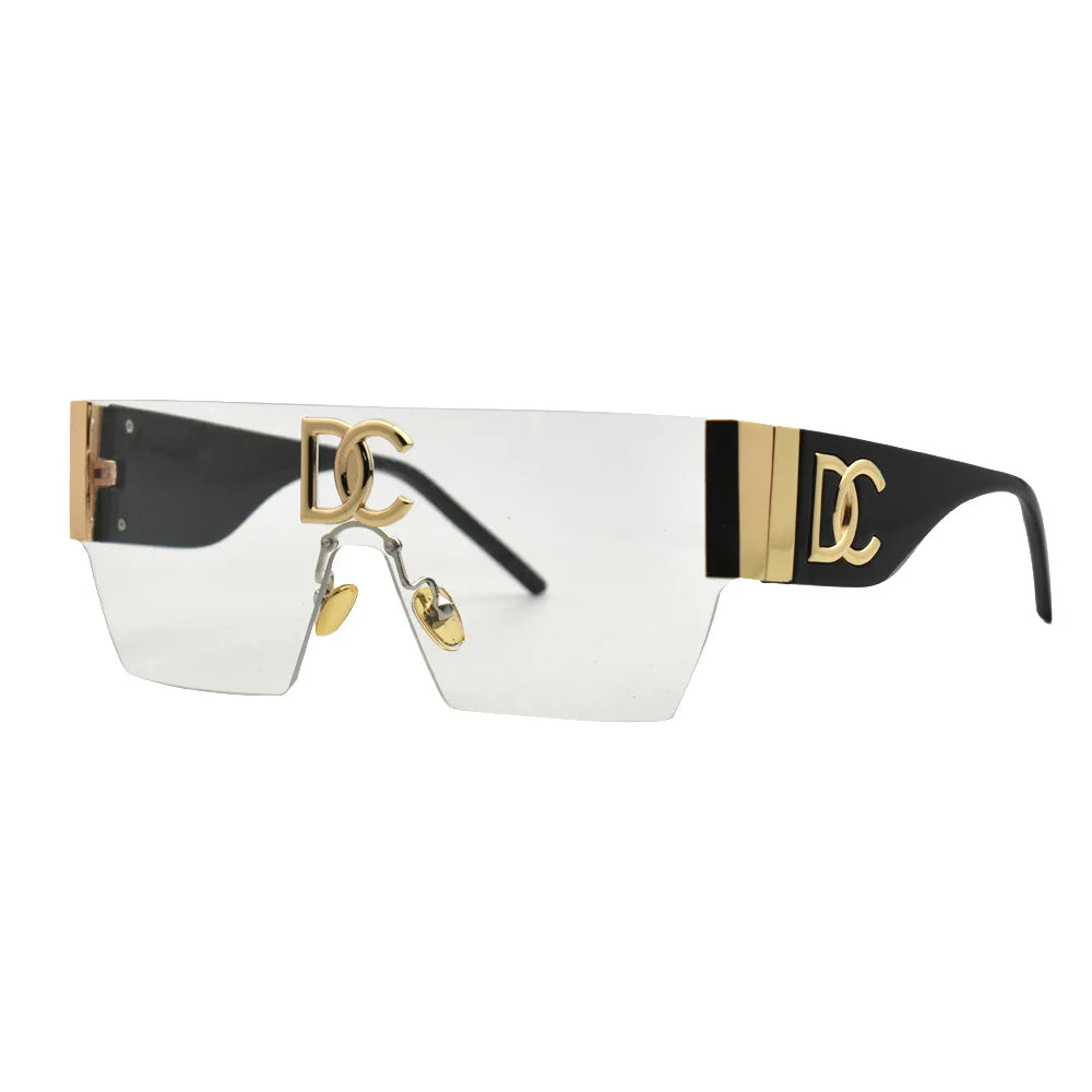 Sunglasses with gold and black frame on a white background