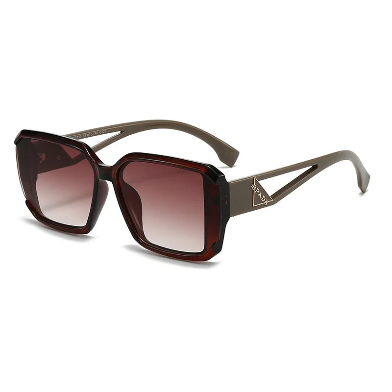 Sunglasses with brown gradient lenses and a brand logo on a white background