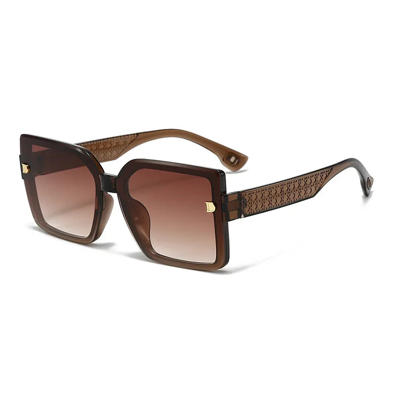 Brown sunglasses with gradient lenses on a white background