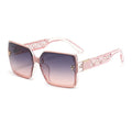 Pink sunglasses with decorative frame on a white background