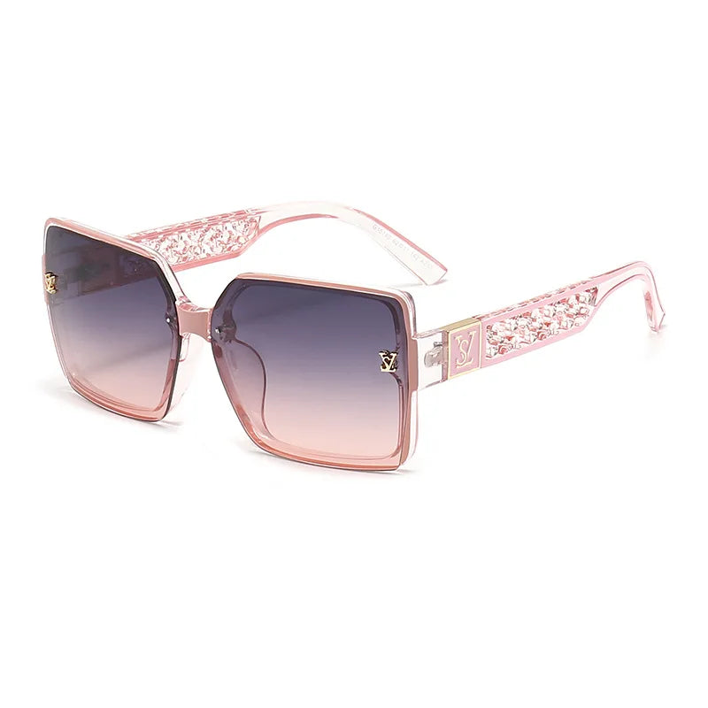 Pink sunglasses with decorative frame on a white background