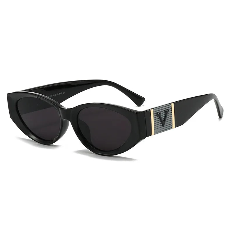 Black sunglasses with a gold logo on a white background