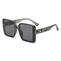 Sunglasses with a metallic frame and dark lenses on a white background