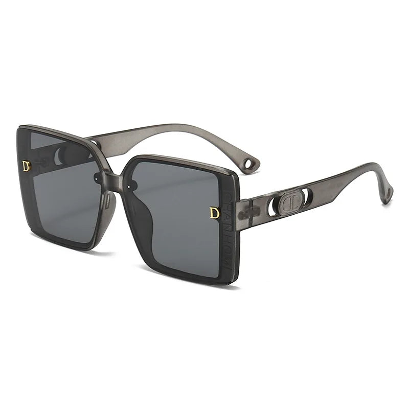 Sunglasses with a metallic frame and dark lenses on a white background