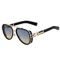 Sunglasses with gold frame and black arms on a white background