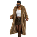 Woman wearing a long brown fur coat on a white background
