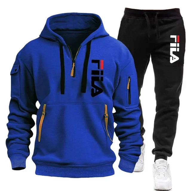 Blue hoodie and black pants with Fila logo on a white background