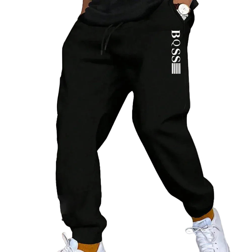 Black tracksuit with 'BOSS' logo on a white background