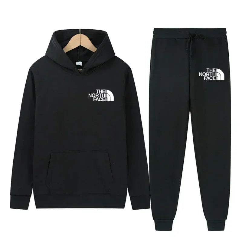 Gray hoodie and jogger pants set with 'The North Face' logo on a white background