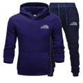Blue hoodie and pants set with 'The Storm Sports' logo on a white background