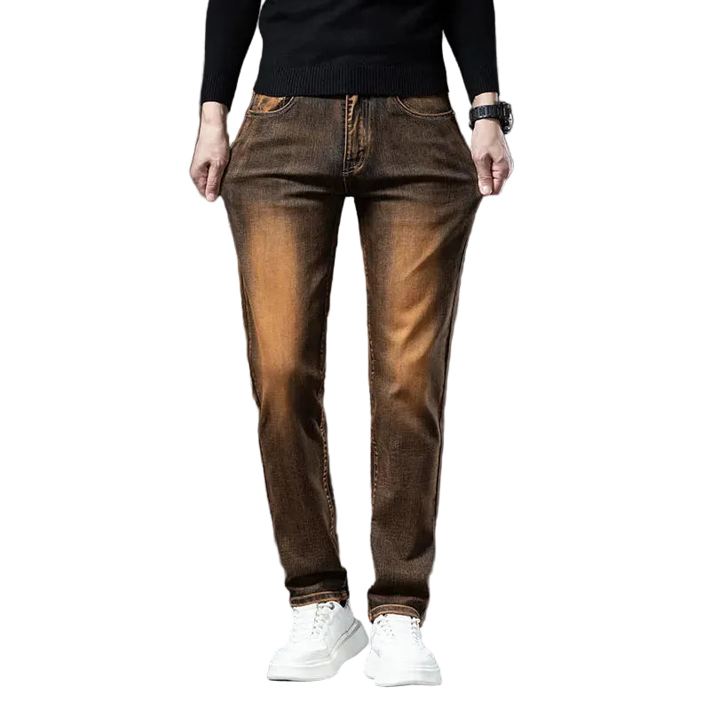 Brown jeans worn by a person on a white background