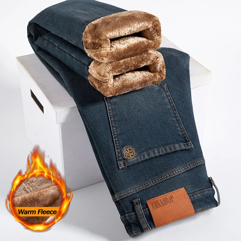Brown denim jeans with warm fleece lining on a white background