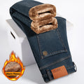 Blue jeans with brown fleece lining on a white background