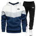 Adidas tracksuit with hoodie and pants on a white background