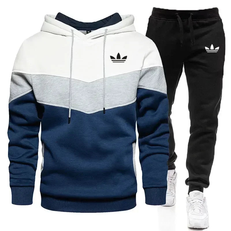 Adidas tracksuit with hoodie and pants on a white background