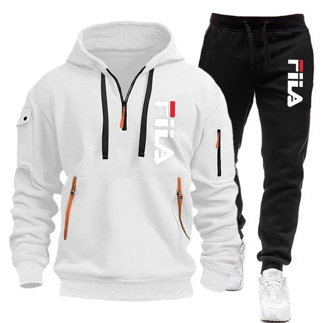 White hoodie and black pants with Fila logo on a white background