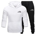 White hoodie and black pants with 'The Storm Sports' logo on a white background