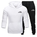 White hoodie and black pants set with 'The Storm Sports' logo on a white background